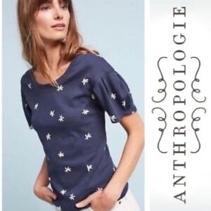 Anthropologie navy blue top with white floral Jasmine print. Puff short sleeves.